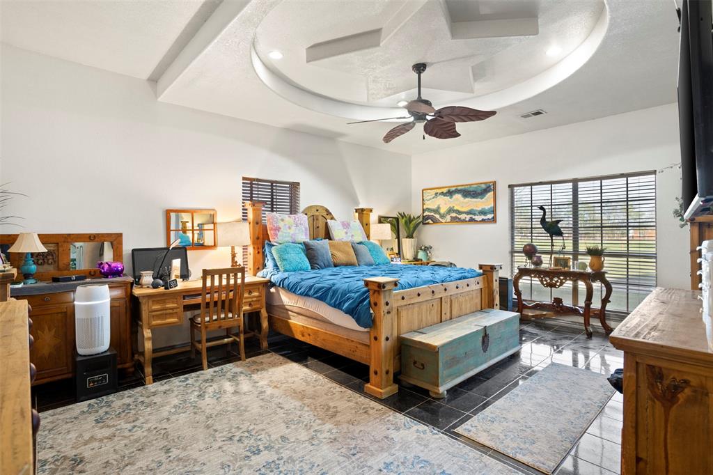 6524 Fair Road Kaufman, TX 75142 - Photo 16 of 30 a bedroom with furniture and a wooden floor