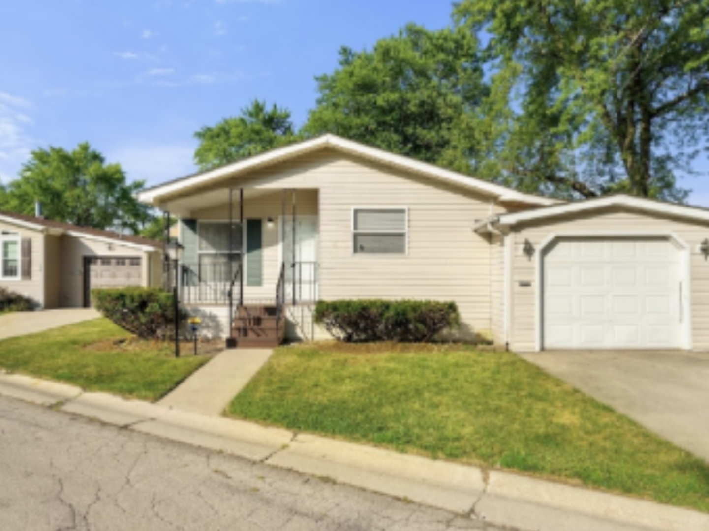 1052 Lake Terrace Road Elgin, IL 60123 - Photo 1 of 9 a front view of a house with a yard and garage