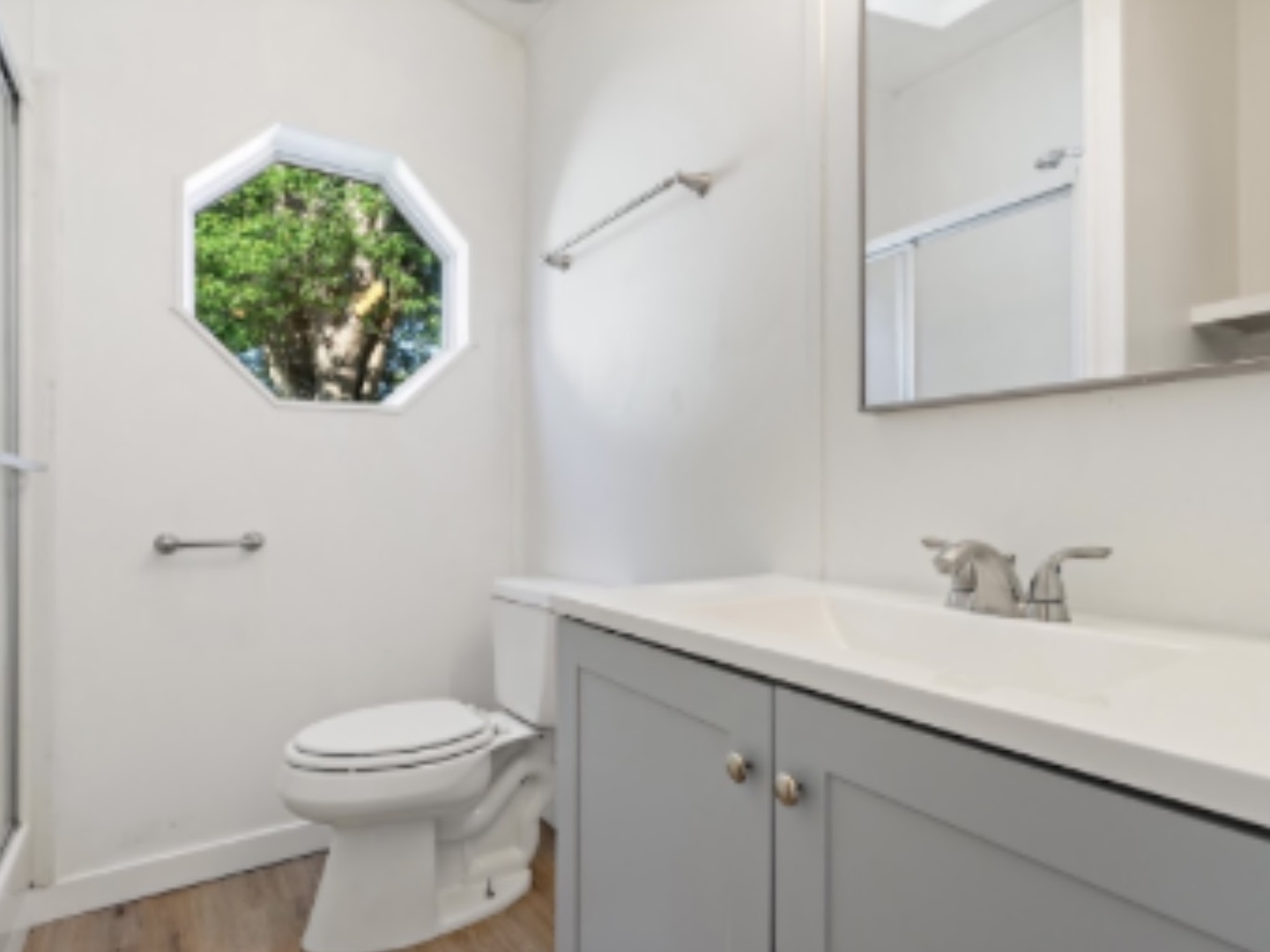 1052 Lake Terrace Road Elgin, IL 60123 - Photo 6 of 9 a bathroom with a toilet a sink and mirror