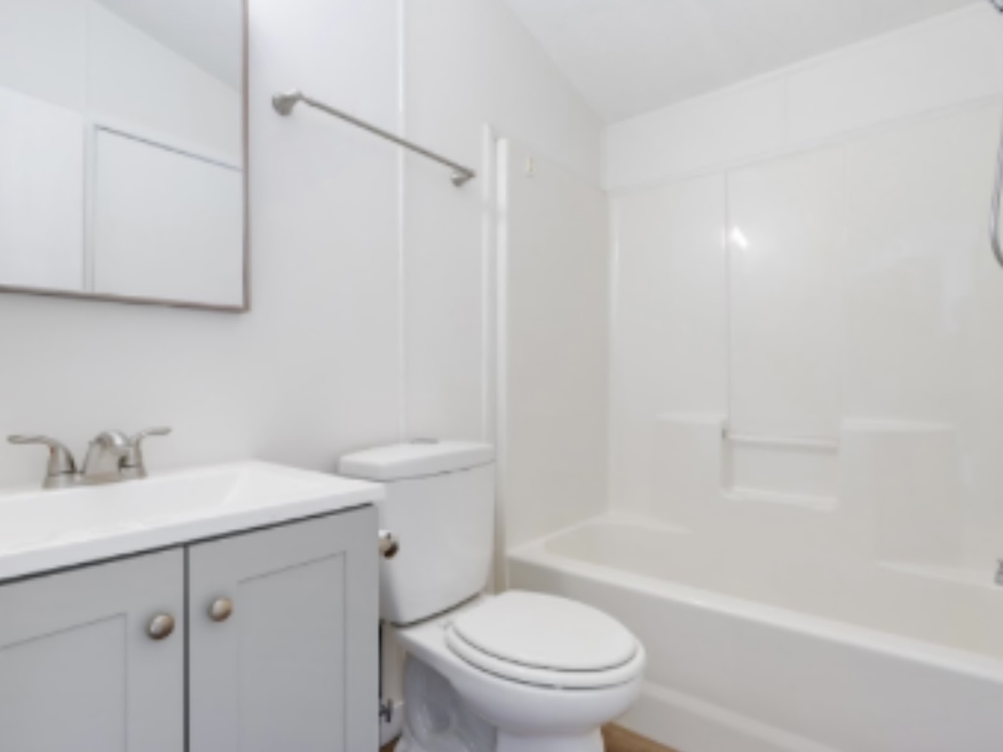 1052 Lake Terrace Road Elgin, IL 60123 - Photo 7 of 9 a bathroom with a sink toilet vanity and shower