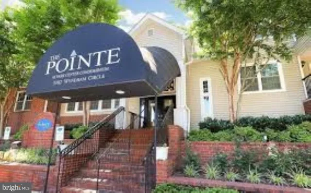 a kitchen with a refrigerator a stove a microwave and cabinets