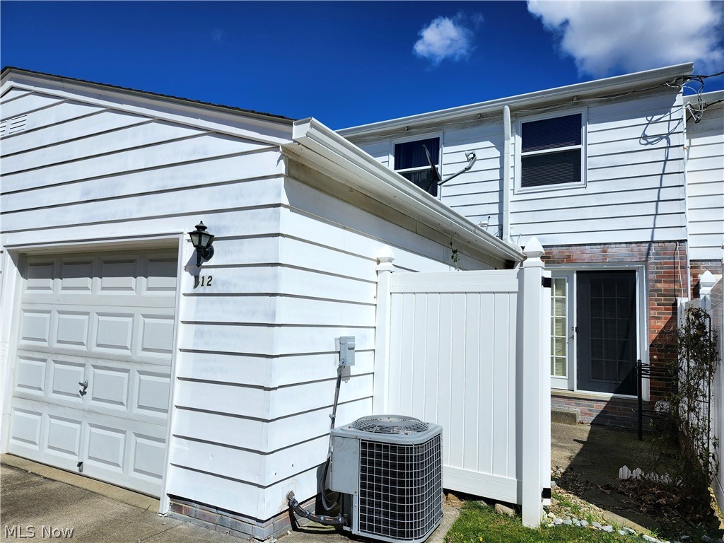 6488 State Road, Unit B 12 Cleveland, OH 44134 - Photo 2 of 46 View of Back of property featuring a garage and central air condition unit
