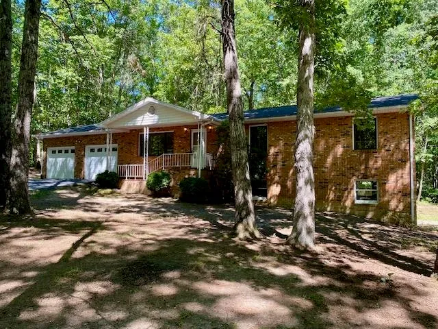 a kitchen with stainless steel appliances a stove cabinets and a wooden floor