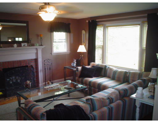1012 Carew Street Springfield, MA 01104 - Photo 3 of 11 a living room with furniture and a fireplace