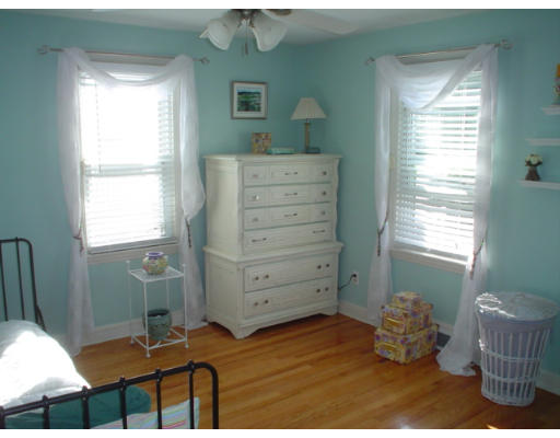 1012 Carew Street Springfield, MA 01104 - Photo 5 of 11 a bedroom with a bed and a window