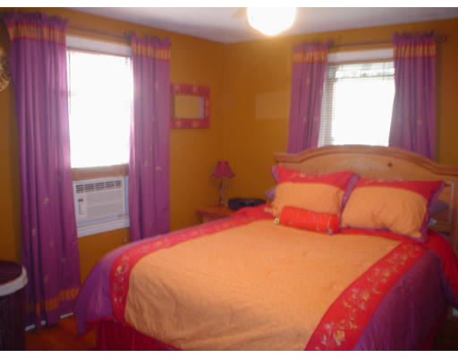 1012 Carew Street Springfield, MA 01104 - Photo 7 of 11 a bedroom with a bed and a window