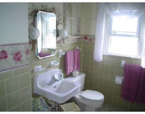 1012 Carew Street Springfield, MA 01104 - Photo 8 of 11 a bathroom with a sink toilet and mirror