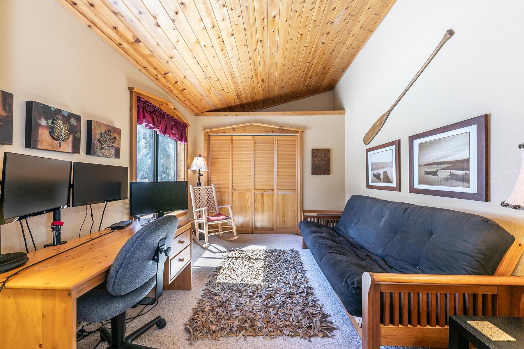 14514 Wolfgang Road Truckee, CA 96161 - Photo 16 of 21 a living room with furniture and a flat screen tv