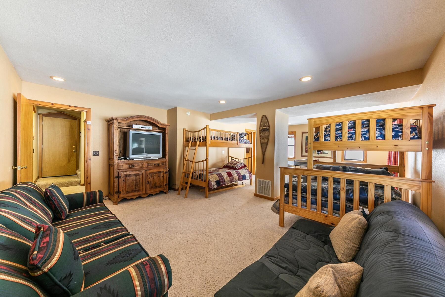 14514 Wolfgang Road Truckee, CA 96161 - Photo 18 of 21 a living room with furniture and a flat screen tv