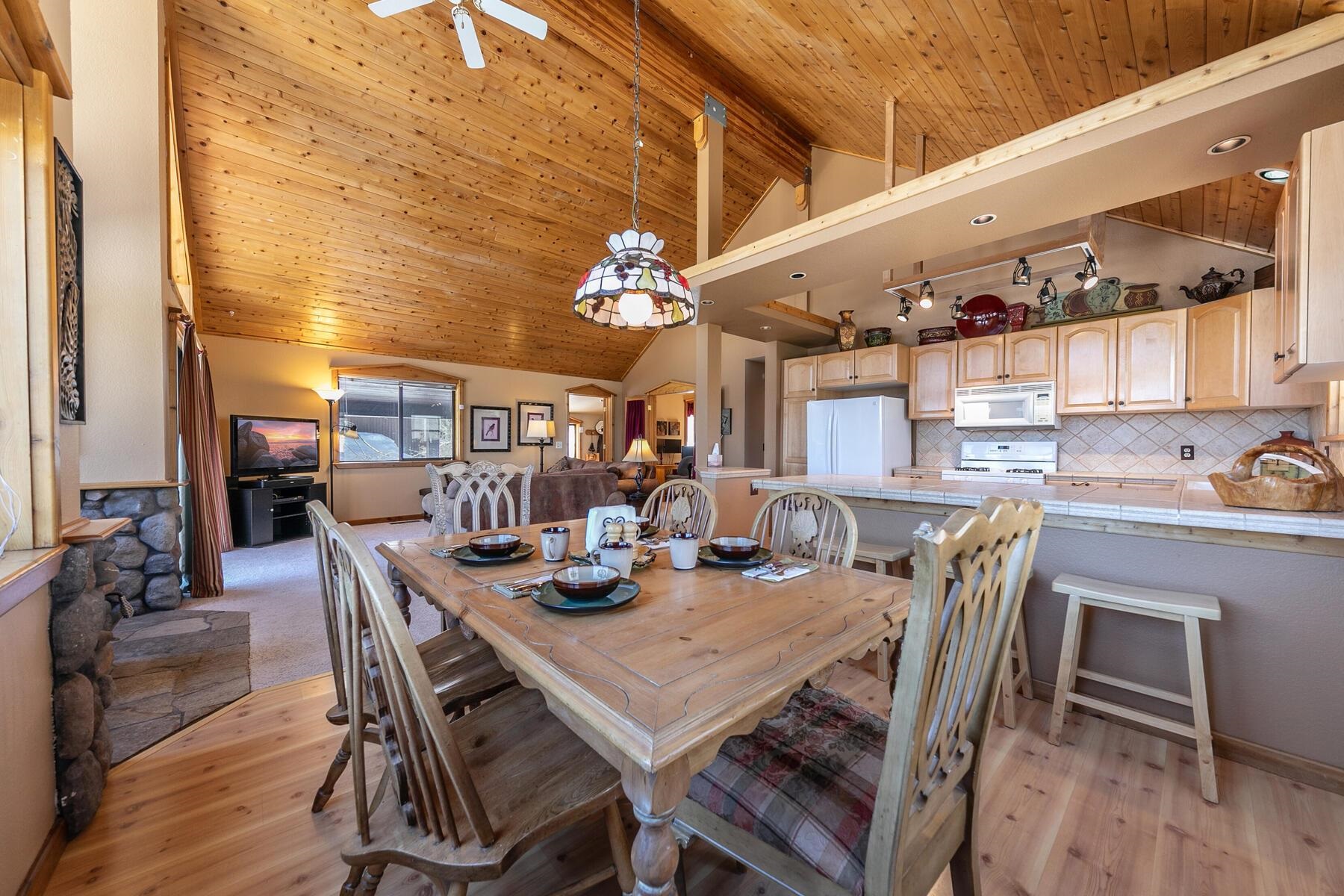 14514 Wolfgang Road Truckee, CA 96161 - Photo 4 of 21 a view of a dining room with furniture and wooden floor