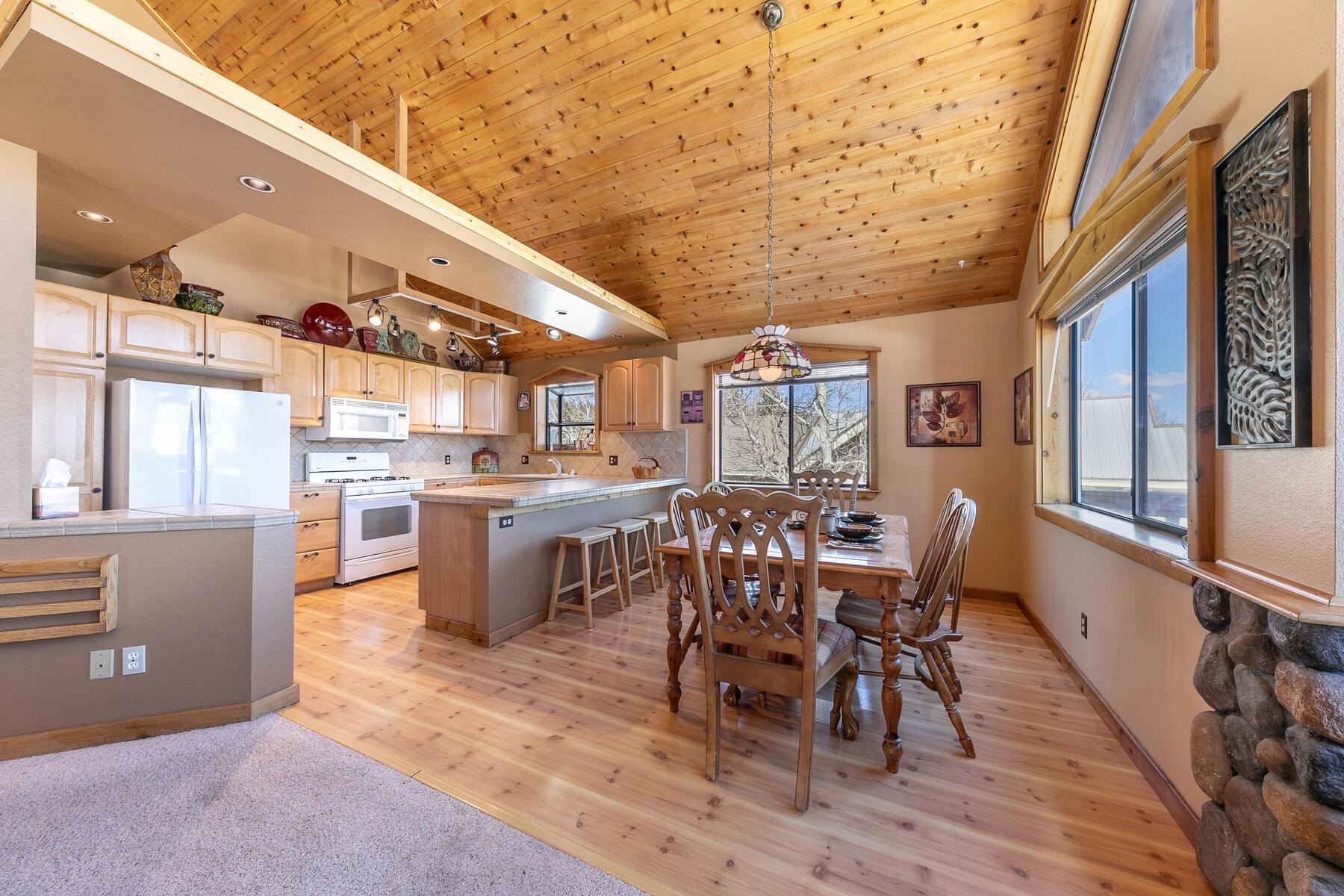 14514 Wolfgang Road Truckee, CA 96161 - Photo 6 of 21 a dining room with furniture and wooden floor