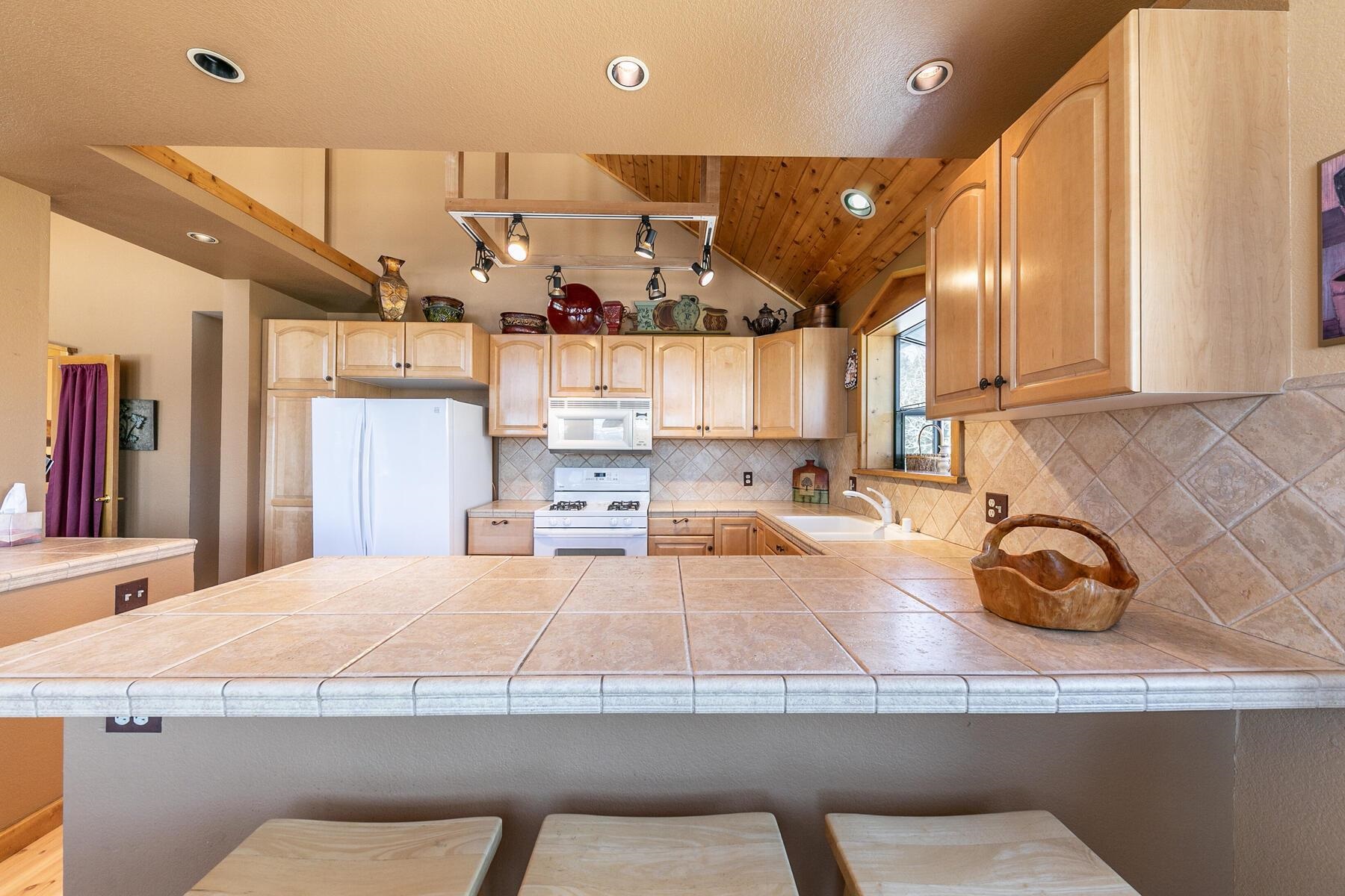 14514 Wolfgang Road Truckee, CA 96161 - Photo 7 of 21 a kitchen with a sink appliances and cabinets