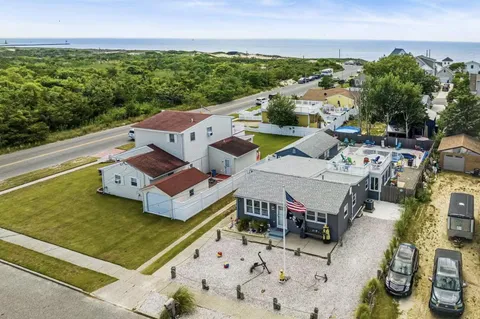 an aerial view of a house with a garden