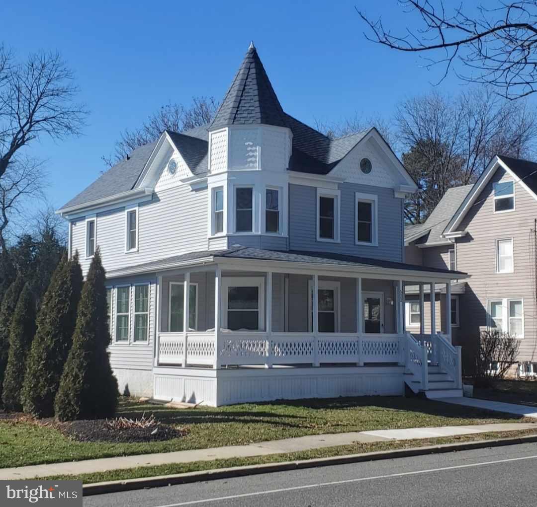 Charming Victorian with turreted elegance.