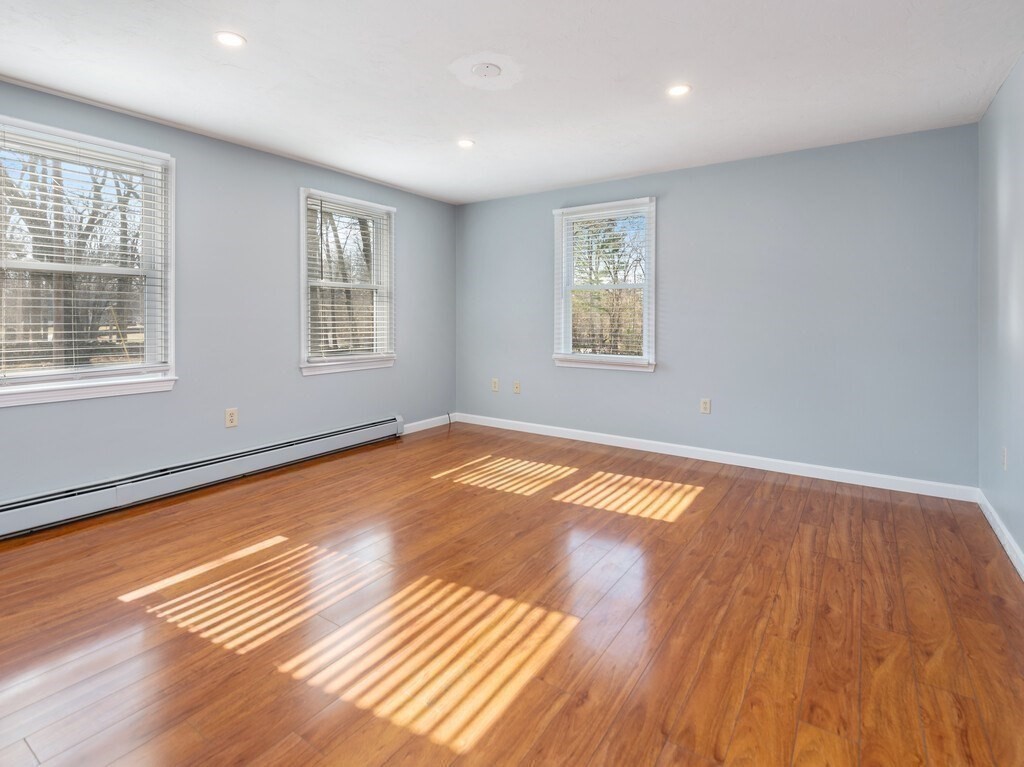 75 J J Davis Road Charlton, MA 01507 - Photo 18 of 33 a view of empty room with wooden floor and fan