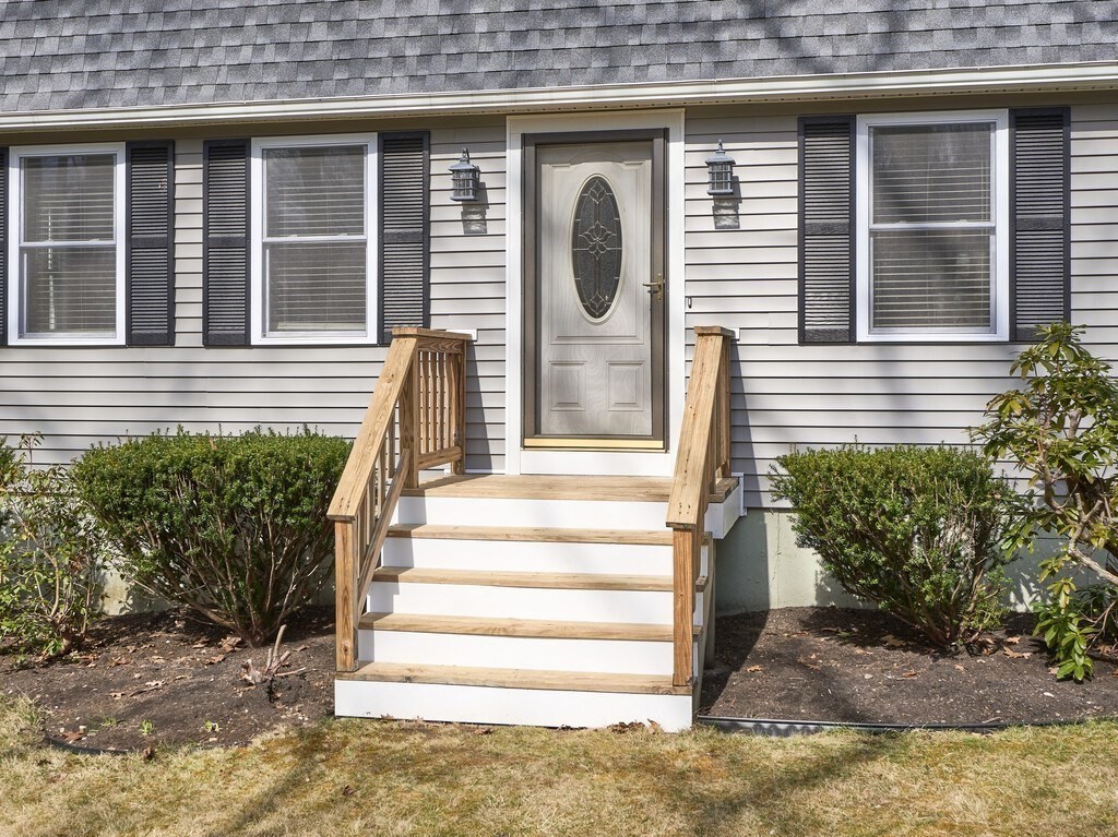 75 J J Davis Road Charlton, MA 01507 - Photo 2 of 33 a front view of a house with a garden