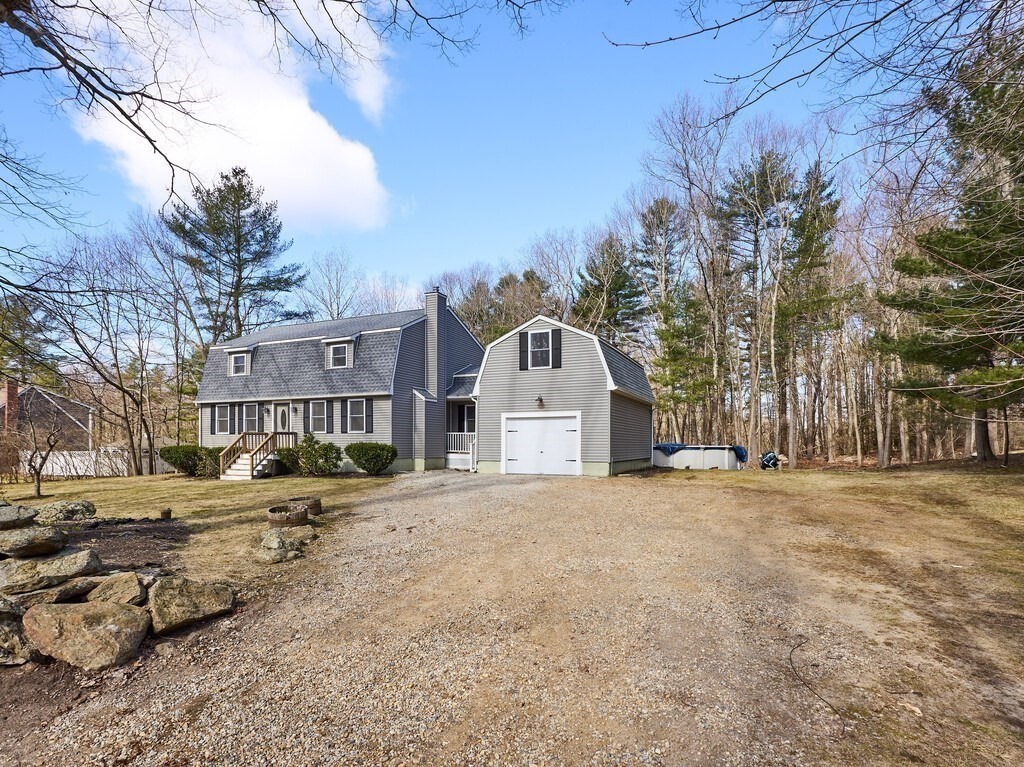 75 J J Davis Road Charlton, MA 01507 - Photo 29 of 33 a view of a white house with a yard