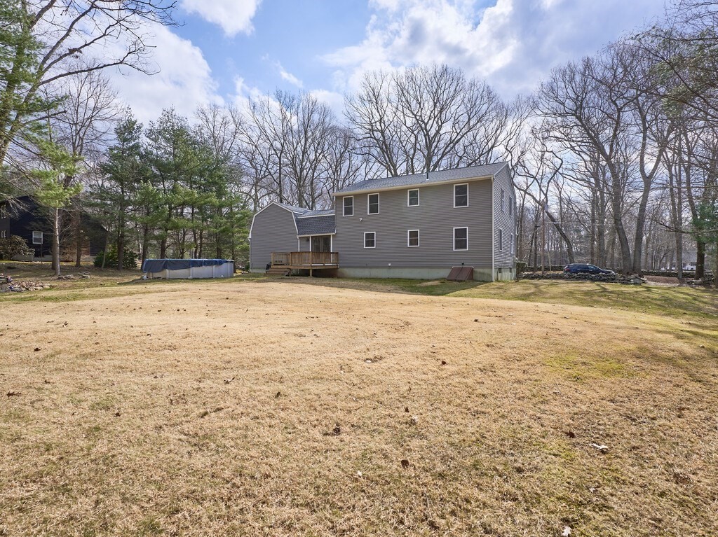 75 J J Davis Road Charlton, MA 01507 - Photo 5 of 33 a view of a house with a yard