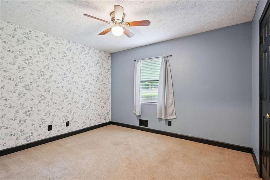 183 Elm Street Covington, GA 30014 - Photo 16 of 23 an empty room with windows