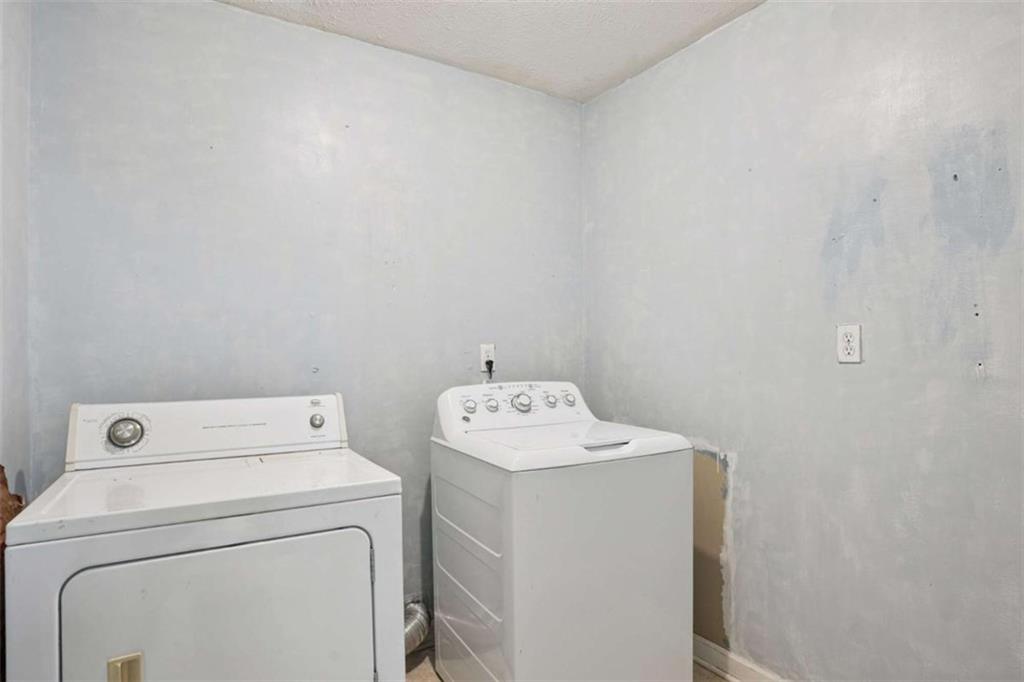 183 Elm Street Covington, GA 30014 - Photo 20 of 23 a utility room with dryer and washer