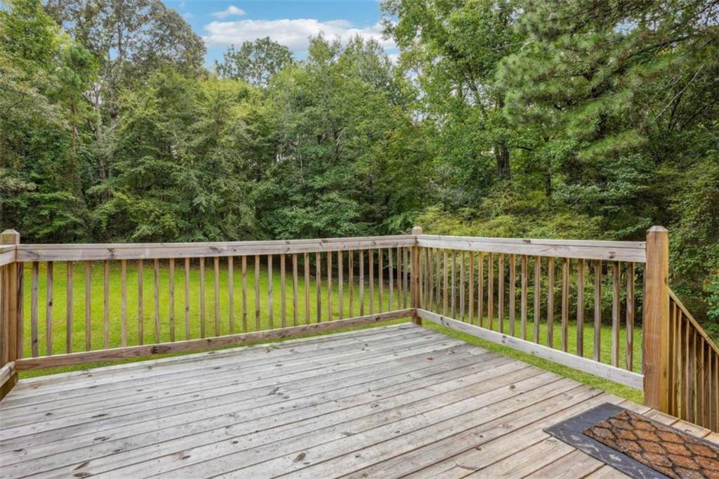 183 Elm Street Covington, GA 30014 - Photo 21 of 23 a view of a wooden deck