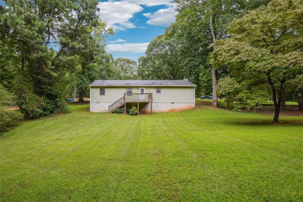 183 Elm Street Covington, GA 30014 - Photo 23 of 23 a front view of a house with yard and trees