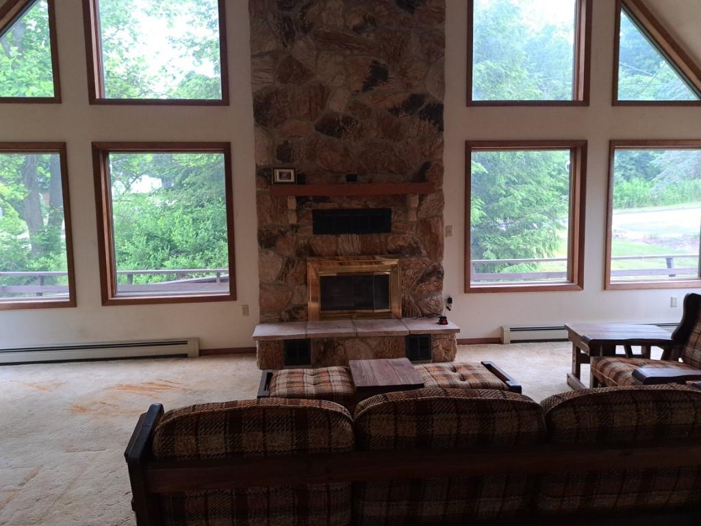 337 Pine Street Kane, PA 16735 - Photo 11 of 14 a living room with a fireplace a large window