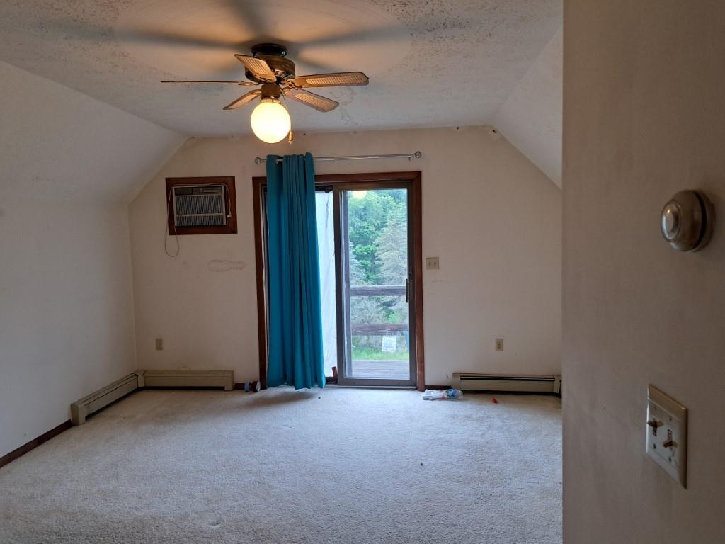 337 Pine Street Kane, PA 16735 - Photo 13 of 14 an empty room with windows and fan