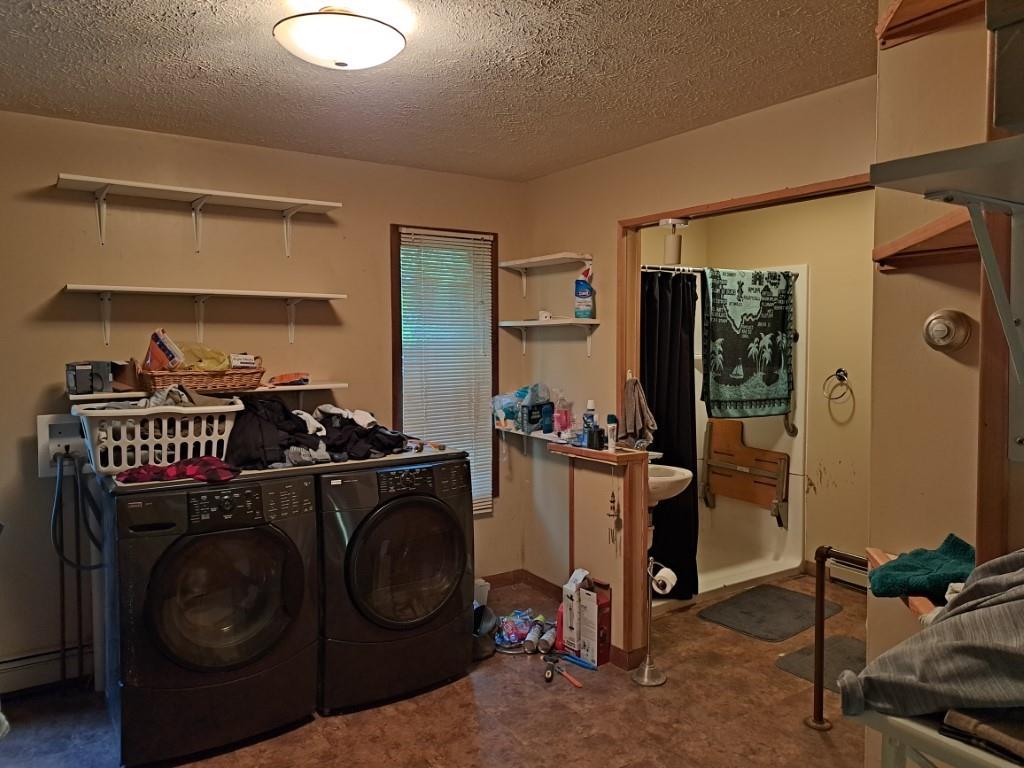 337 Pine Street Kane, PA 16735 - Photo 8 of 14 a utility room with closet dryer and washer