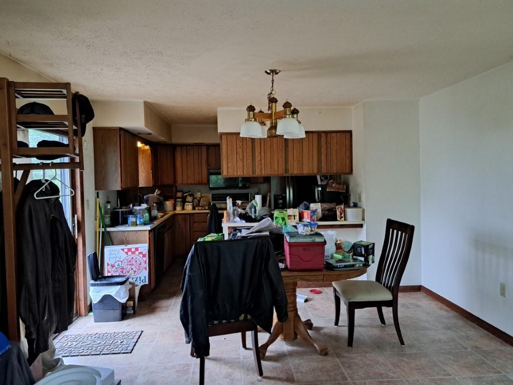 337 Pine Street Kane, PA 16735 - Photo 10 of 14 a view of a dining room with furniture and chandelier
