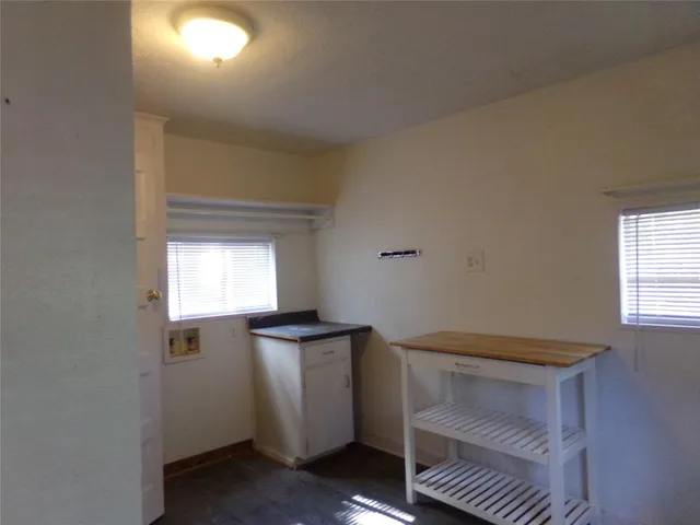 a view of a hallway with windows