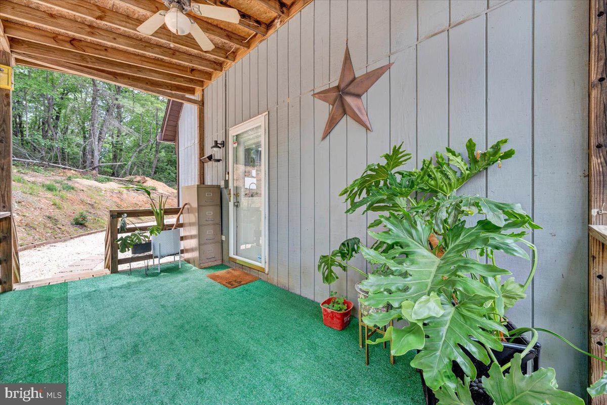 722 Foley Ridge Road Stuart, VA 24171 - Photo 49 of 67 Charming porch with lush greenery.