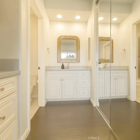 a bathroom with a double vanity sink a mirror and a shower