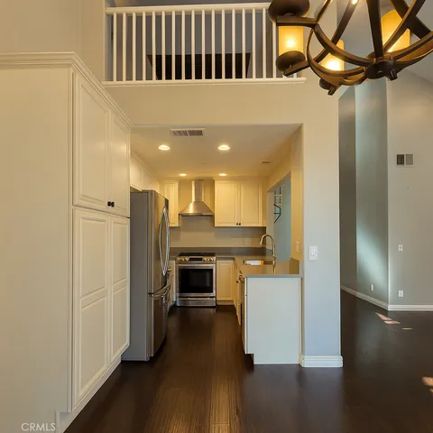 a view of a kitchen from the hallway