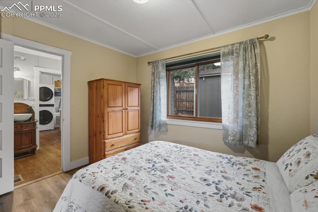 9445 Mohawk Trail Cascade, CO 80809 - Photo 17 of 47 a bedroom with a bed and a window