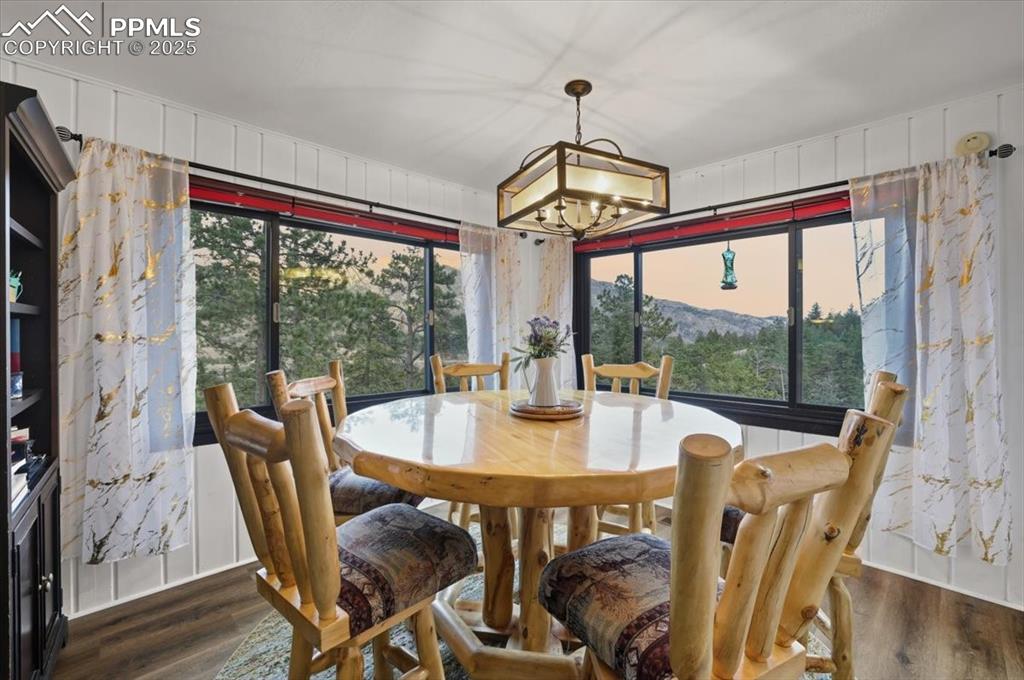 9445 Mohawk Trail Cascade, CO 80809 - Photo 22 of 47 a view of a dining room with furniture window and outside view