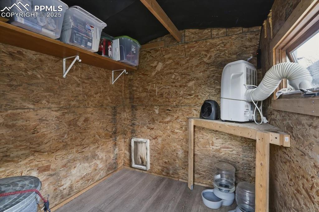 9445 Mohawk Trail Cascade, CO 80809 - Photo 33 of 47 a bathroom with a toilet and a wooden floor