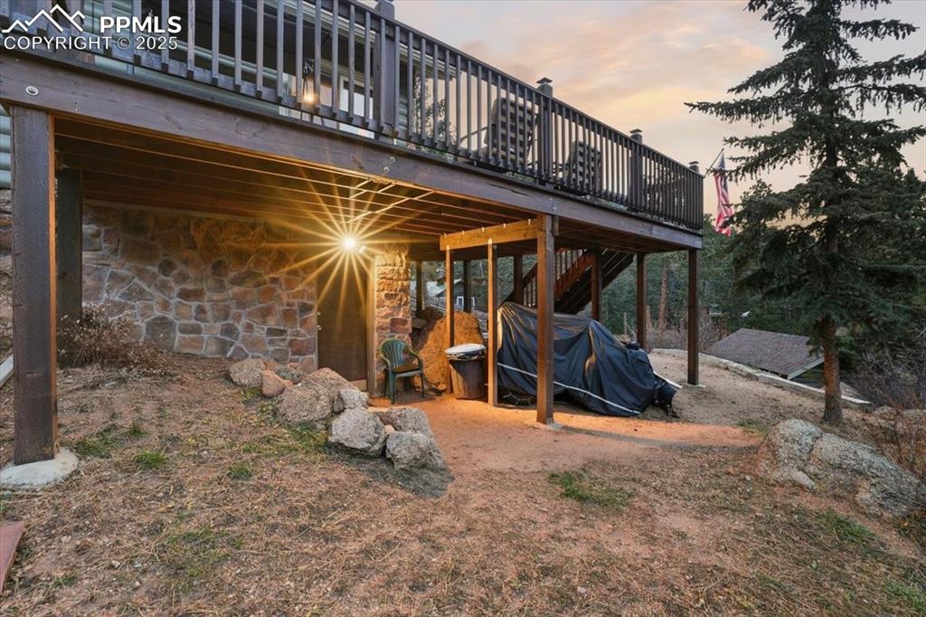 9445 Mohawk Trail Cascade, CO 80809 - Photo 37 of 47 a view of a chairs room with a wooden fence