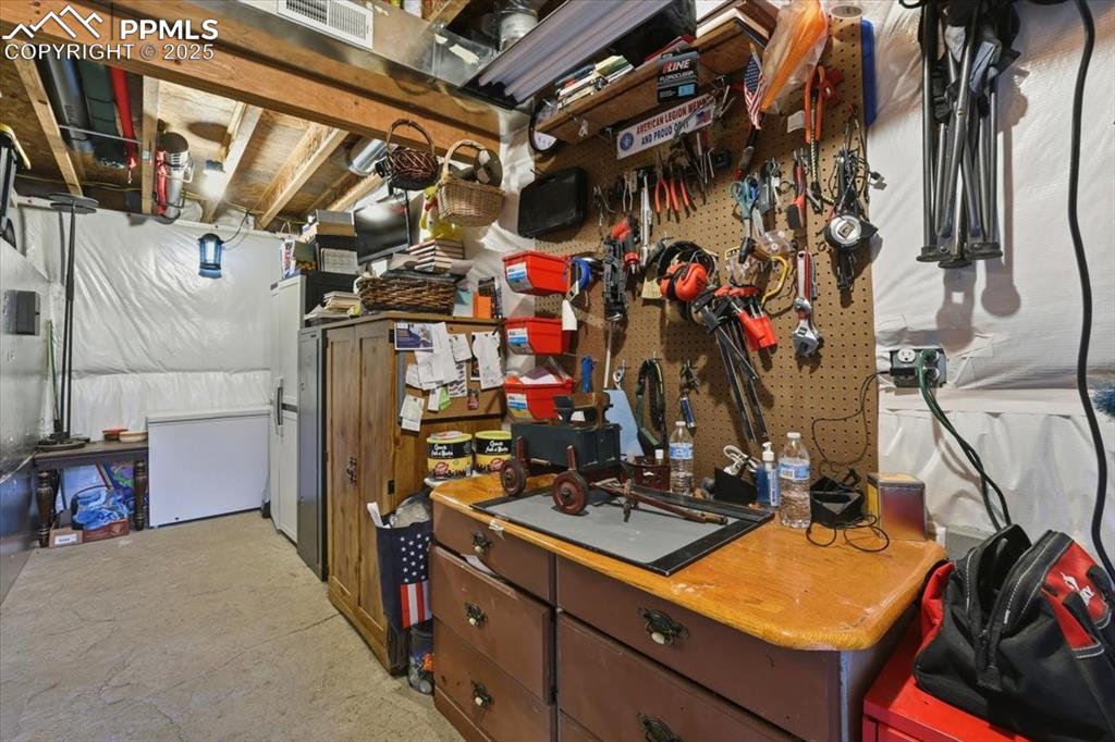 9445 Mohawk Trail Cascade, CO 80809 - Photo 39 of 47 a view of walk in closet with clothes and shoes