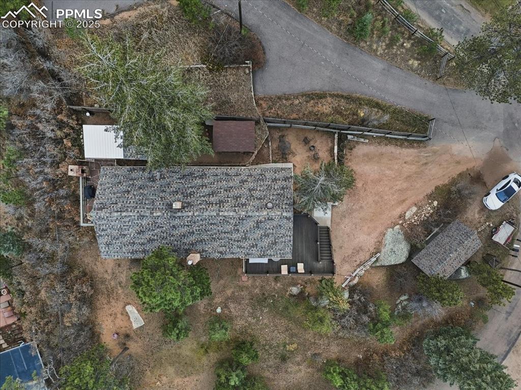 9445 Mohawk Trail Cascade, CO 80809 - Photo 45 of 47 a aerial view of a fireplace with plants