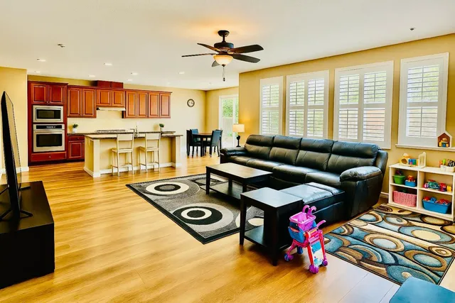 a view of swimming pool with a patio and a yard
