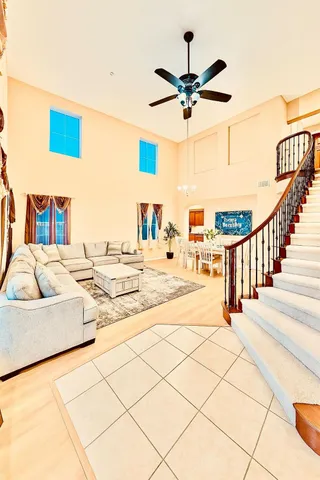 a view of a living room and a ceiling fan
