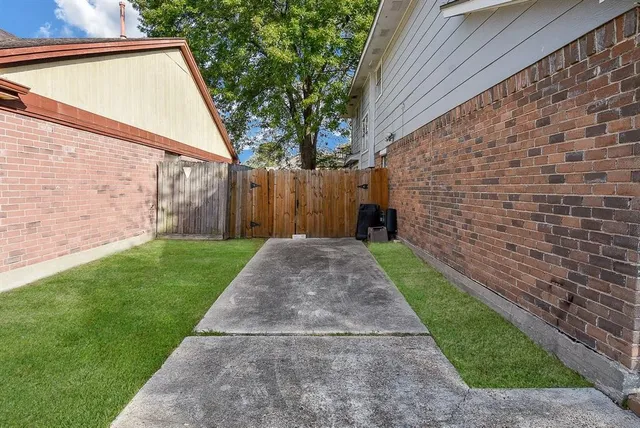 a view of a back yard of the house