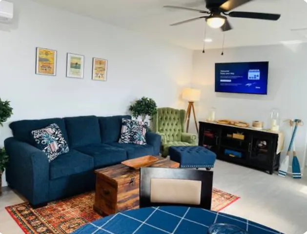 a living room with furniture and a flat screen tv