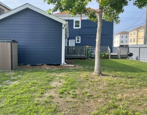 a view of a backyard of the house