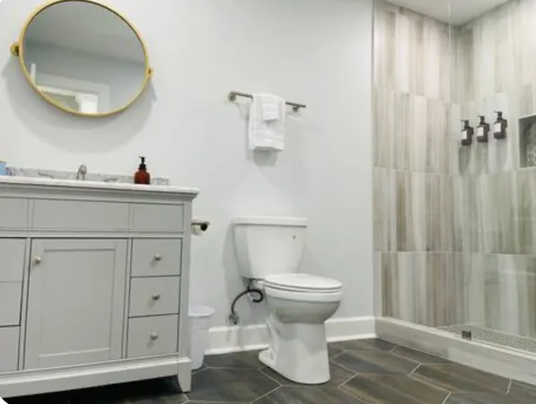 a bathroom with a sink toilet and shower