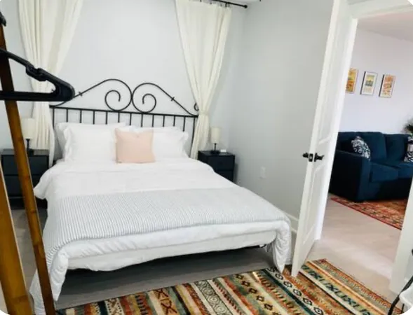 a bedroom with a bed and a walk in closet