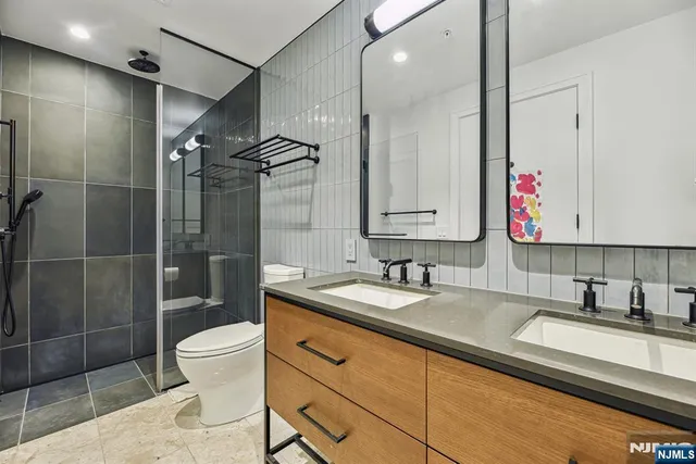 a bedroom with a bed and a view of bathroom