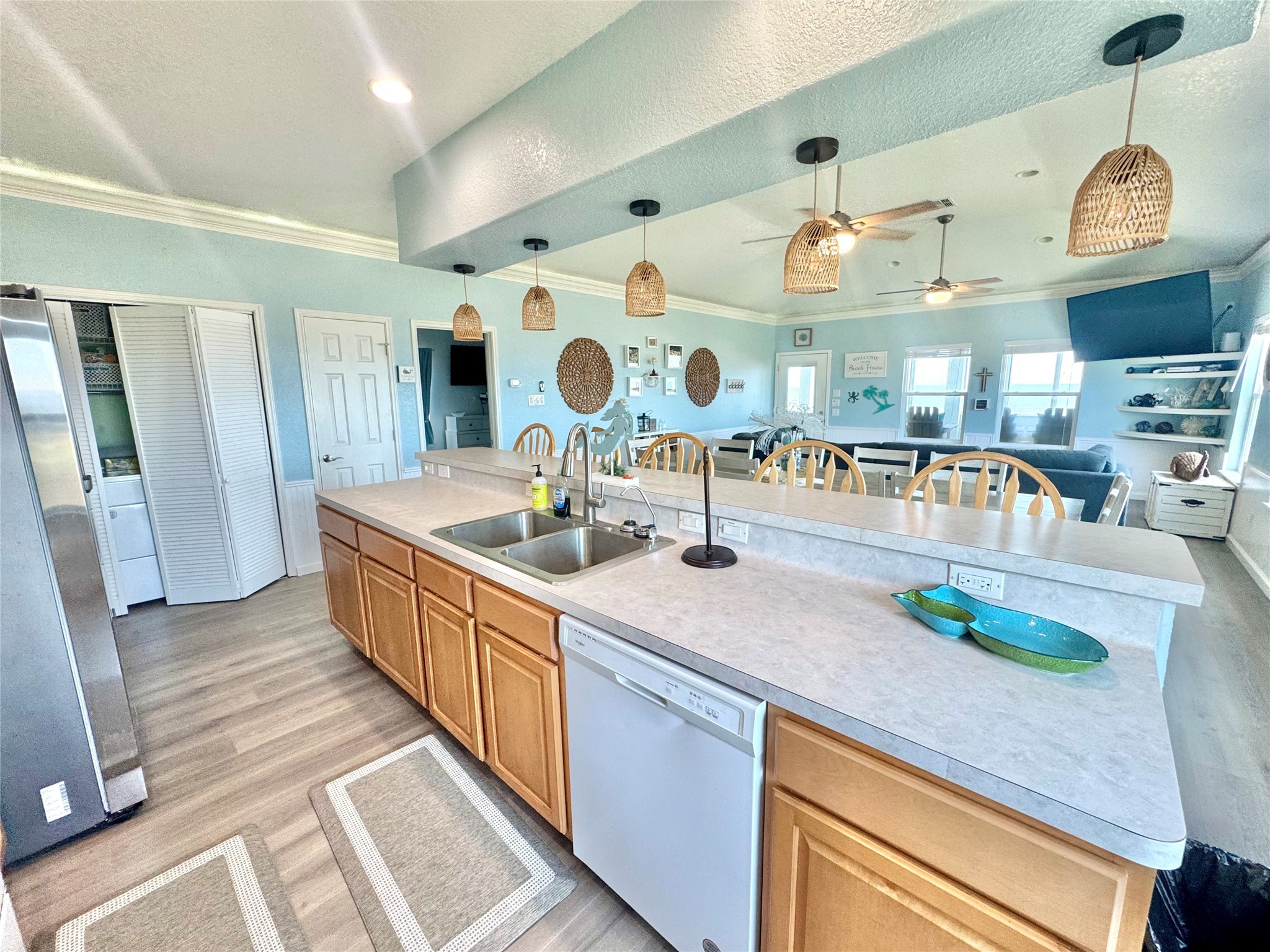 101 Salt Grass Avenue Surfside Beach, TX 77541 - Photo 15 of 48 a kitchen with lots of counter space and wooden floor