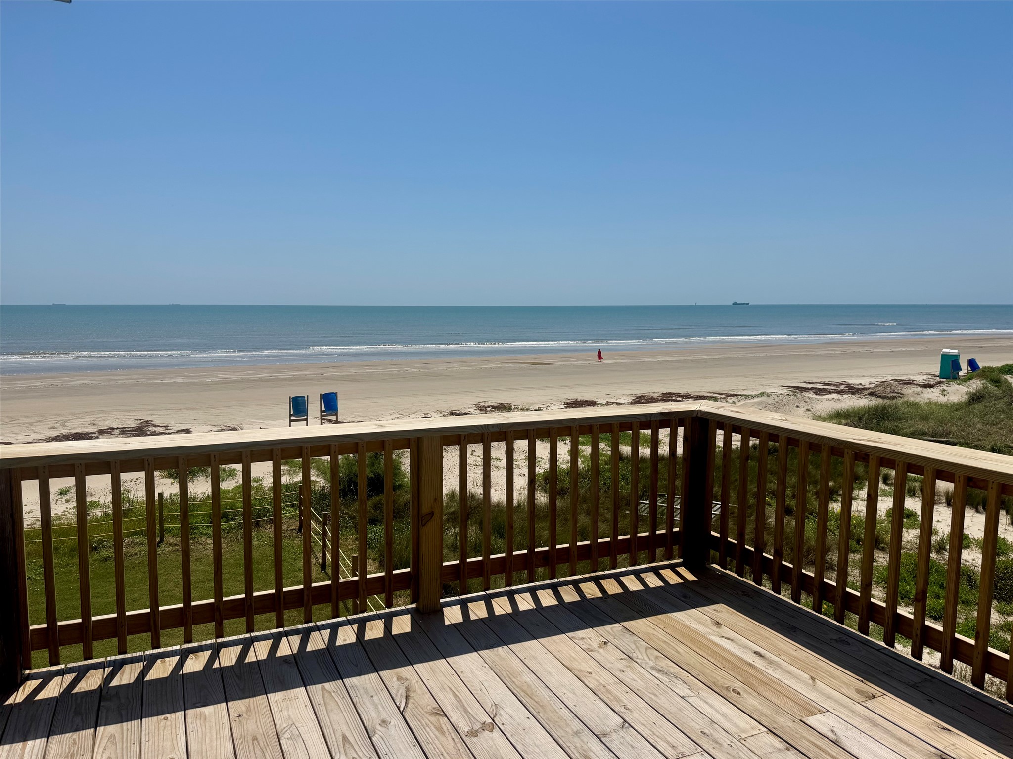 101 Salt Grass Avenue Surfside Beach, TX 77541 - Photo 8 of 48 a view of wooden balcony with wooden floor